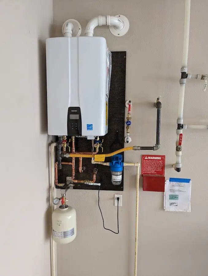 Professional plumber installing copper piping in a Calexico home